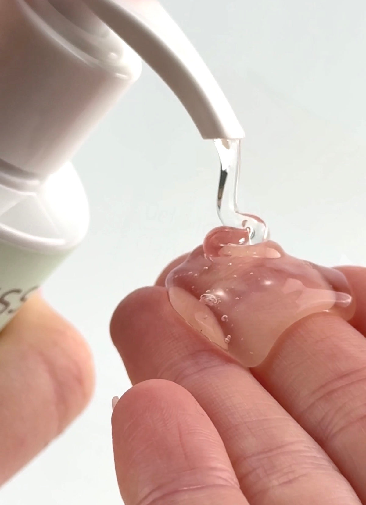Cleansing gel dispensed onto fingertips